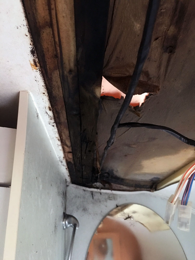 The damaged caravan framework revealed